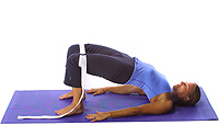 Yoga: Spinal lift half bridge with strap 1