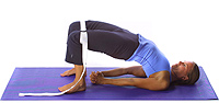 Yoga: Spinal lift half bridge hands yoga mutra with strap 1